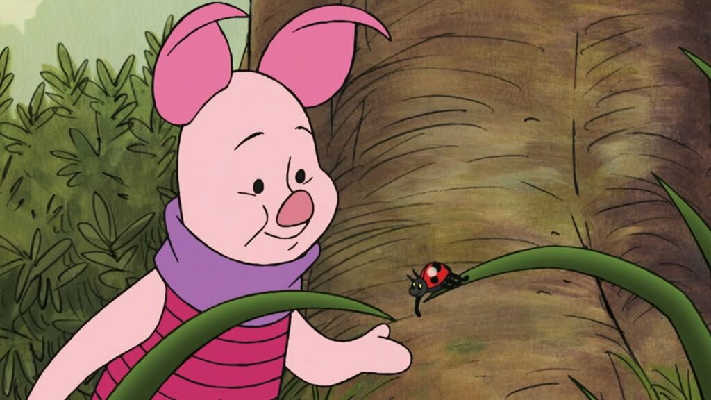 The Endearing Charm of Winnie the Pooh and Friends 15 A cartoon illustration of Piglet from Winnie-the-Pooh, a small pink pig wearing a purple scarf, pointing at a red ladybug on a large green leaf stem.